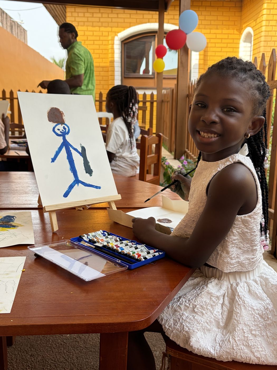 A BrightSteps student painting during Art and Craft