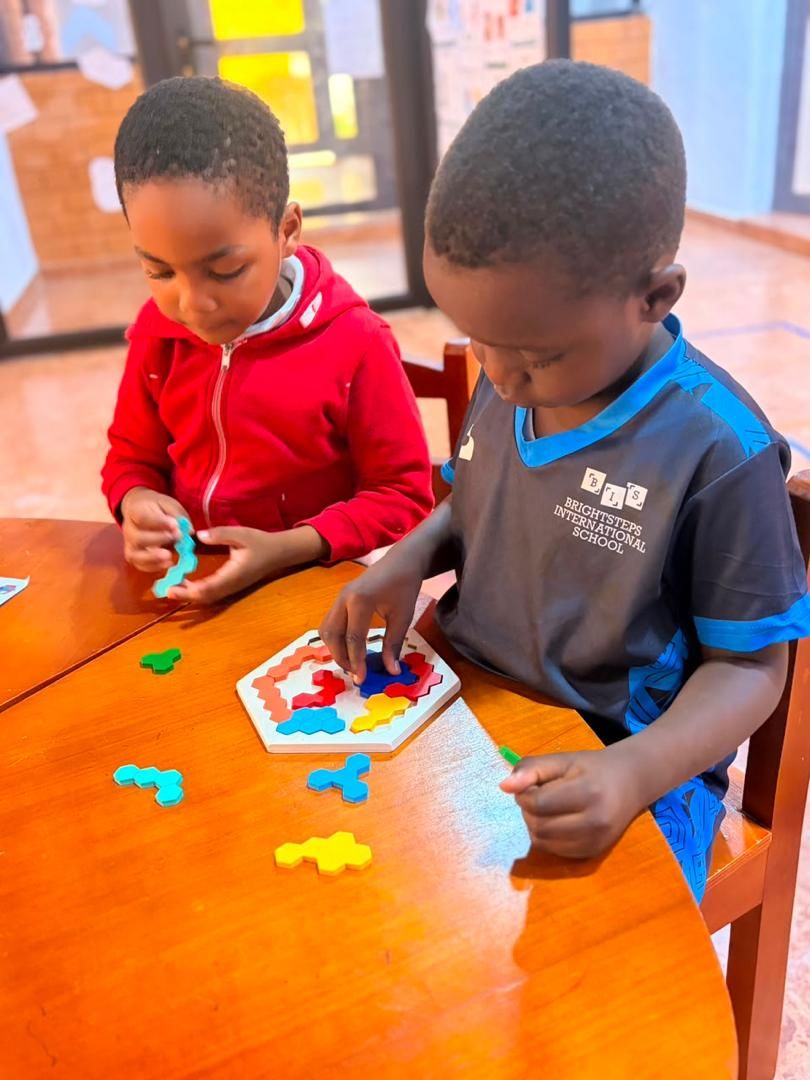 BrightSteps students solving a puzzle together